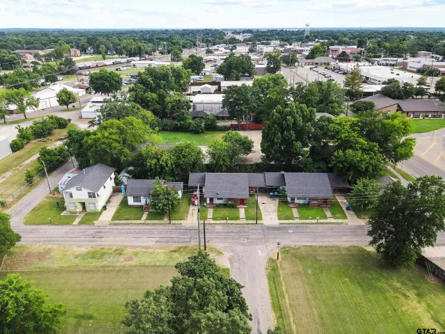 an aerial view of house with yard swimming pool and outdoor seating