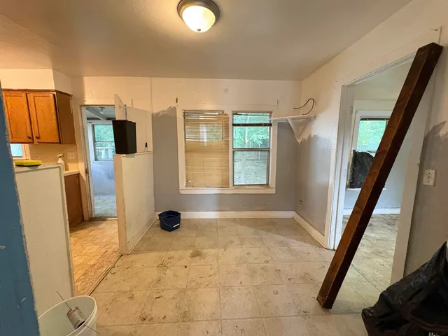 a bathroom with a sink toilet vanity and tub