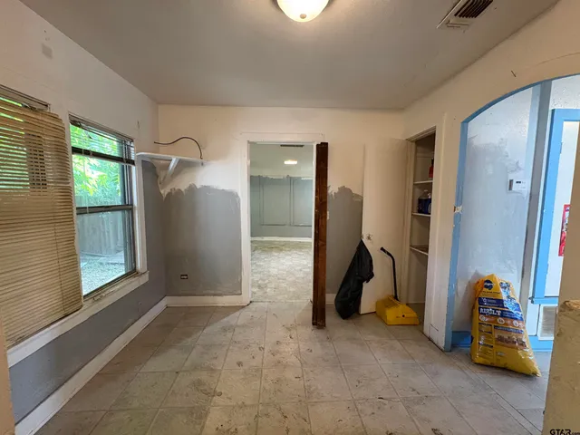 a view of an empty room with a window