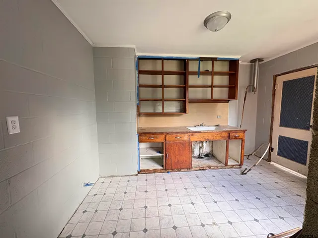 a view of workspace with furniture and window