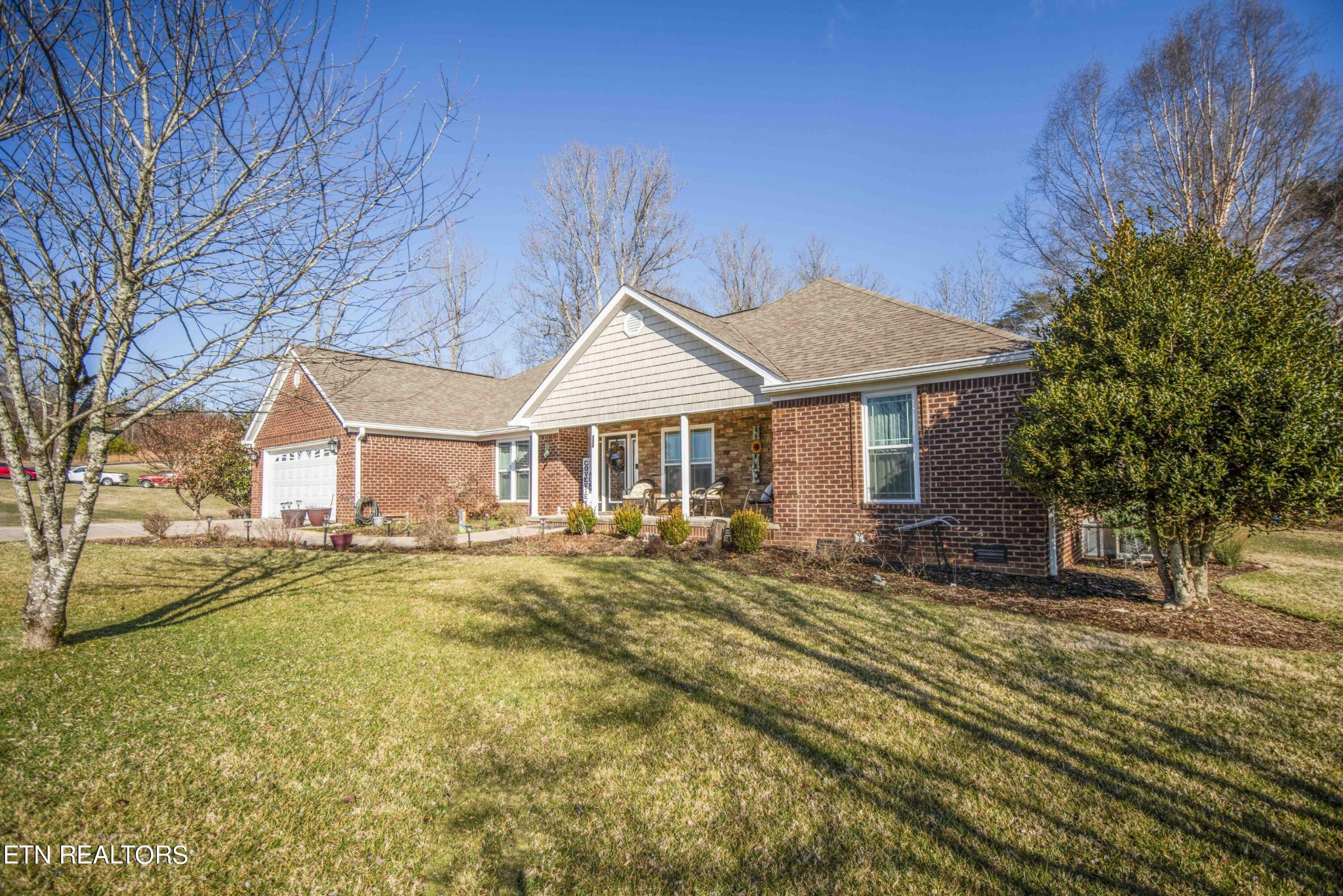 174 Spring Cove Lane Spring City, TN 37381 - Photo 1 of 50 a front view of a house with a yard