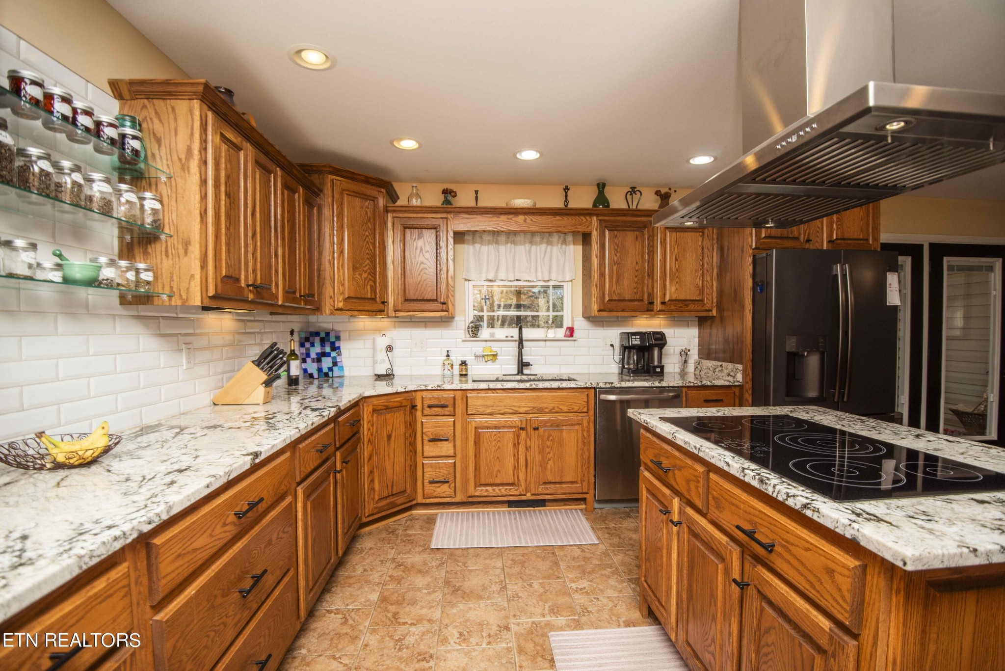 174 Spring Cove Lane Spring City, TN 37381 - Photo 11 of 50 a kitchen with a sink stove and cabinets
