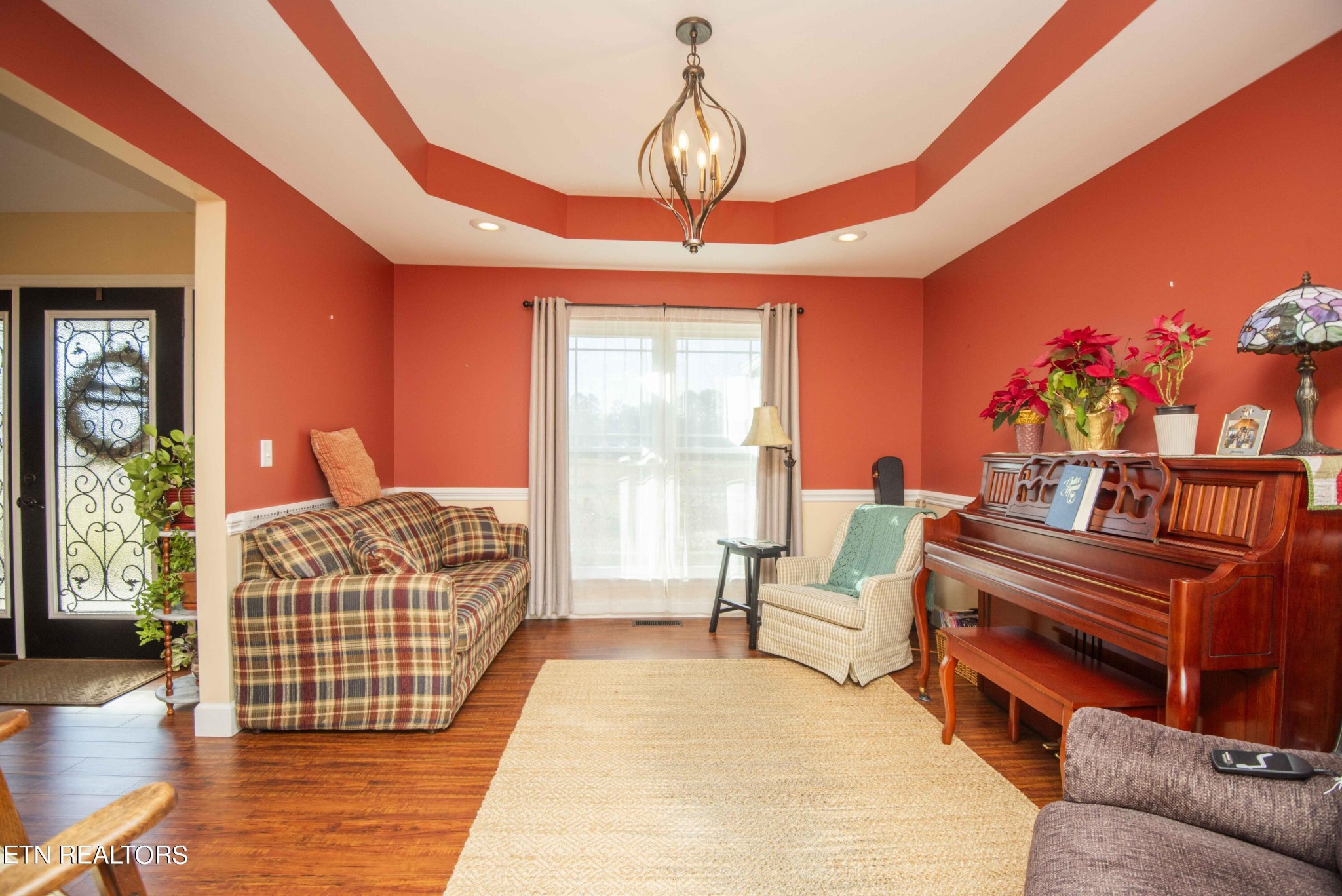 174 Spring Cove Lane Spring City, TN 37381 - Photo 14 of 50 a bedroom with a bed and a chandelier