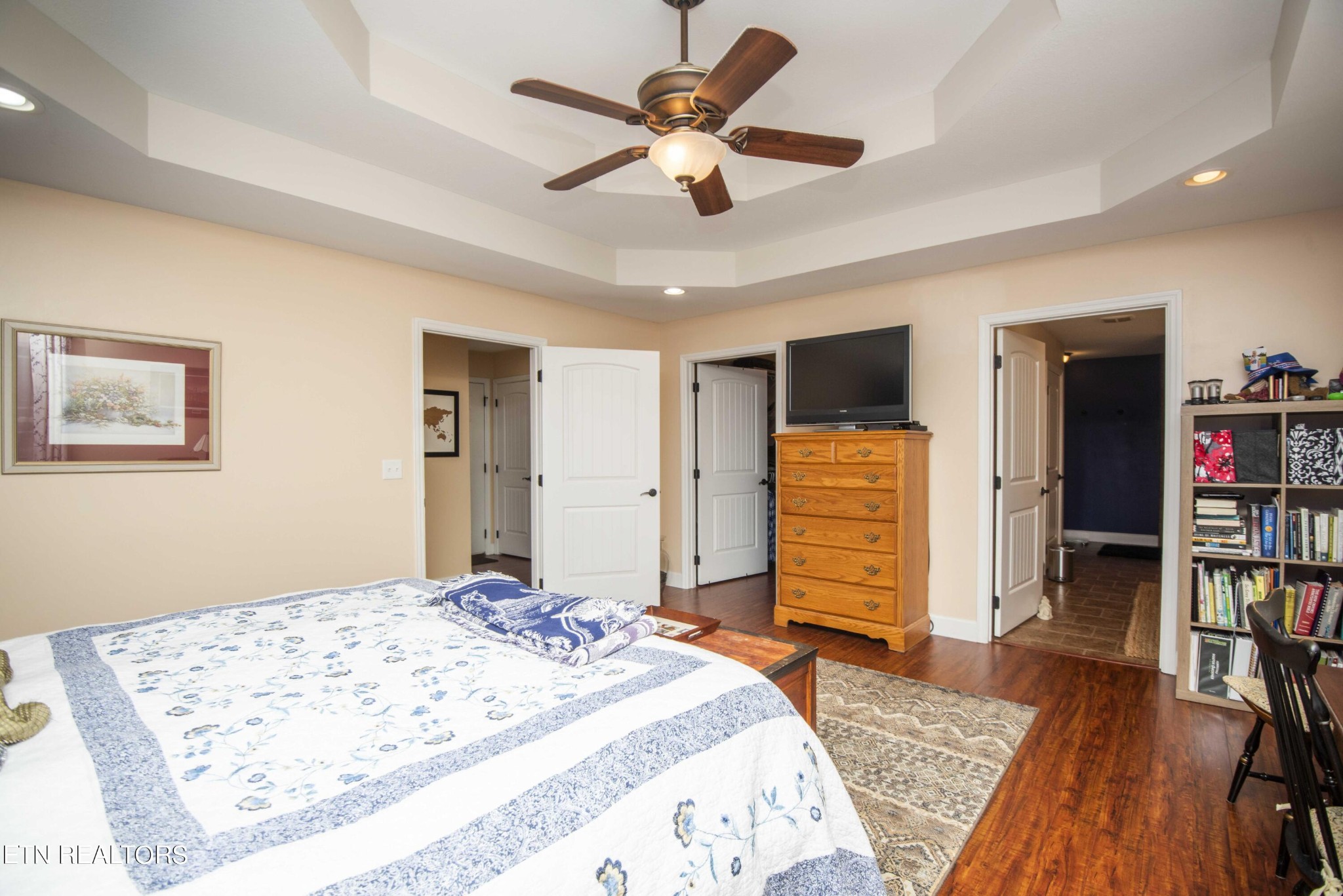 174 Spring Cove Lane Spring City, TN 37381 - Photo 19 of 50 a bedroom with a bed and a flat screen tv
