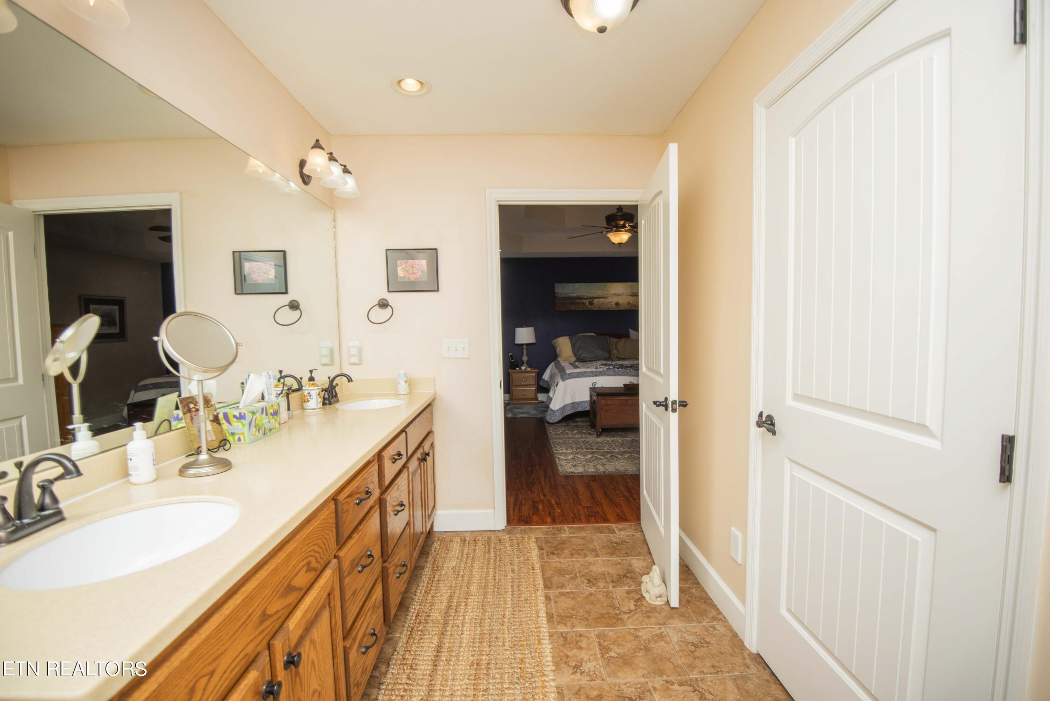 174 Spring Cove Lane Spring City, TN 37381 - Photo 20 of 50 a en suite bathroom with a double vanity sink and a mirror