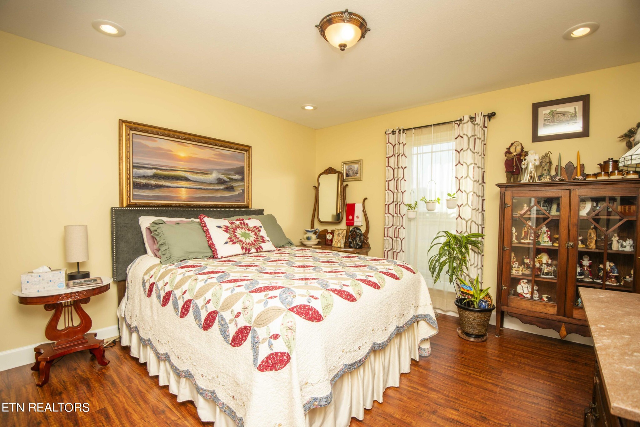 174 Spring Cove Lane Spring City, TN 37381 - Photo 23 of 50 a bedroom with a bed and wooden floor
