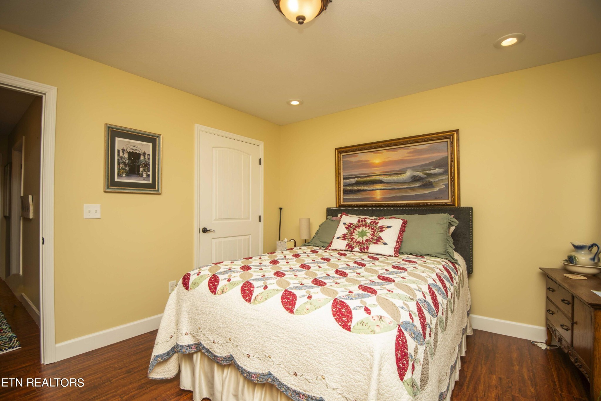 174 Spring Cove Lane Spring City, TN 37381 - Photo 24 of 50 a bedroom with a bed and wooden floor