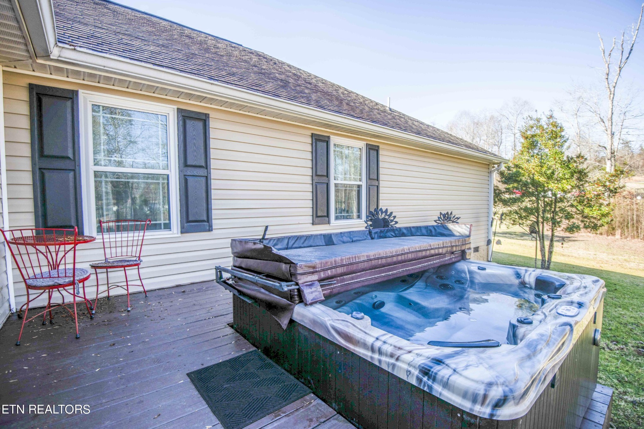 174 Spring Cove Lane Spring City, TN 37381 - Photo 33 of 50 a outdoor sitting area with a couch