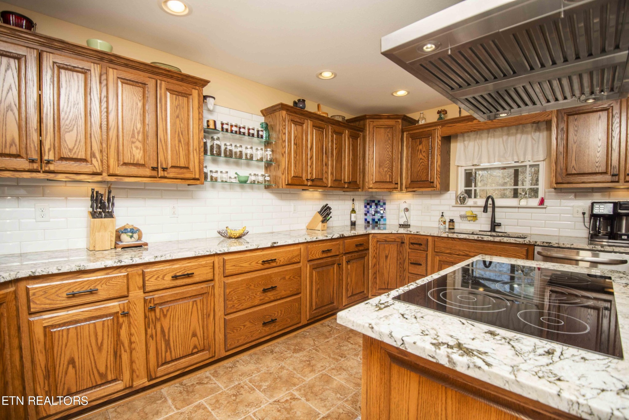 174 Spring Cove Lane Spring City, TN 37381 - Photo 10 of 50 a kitchen with stainless steel appliances granite countertop a sink stove and cabinets