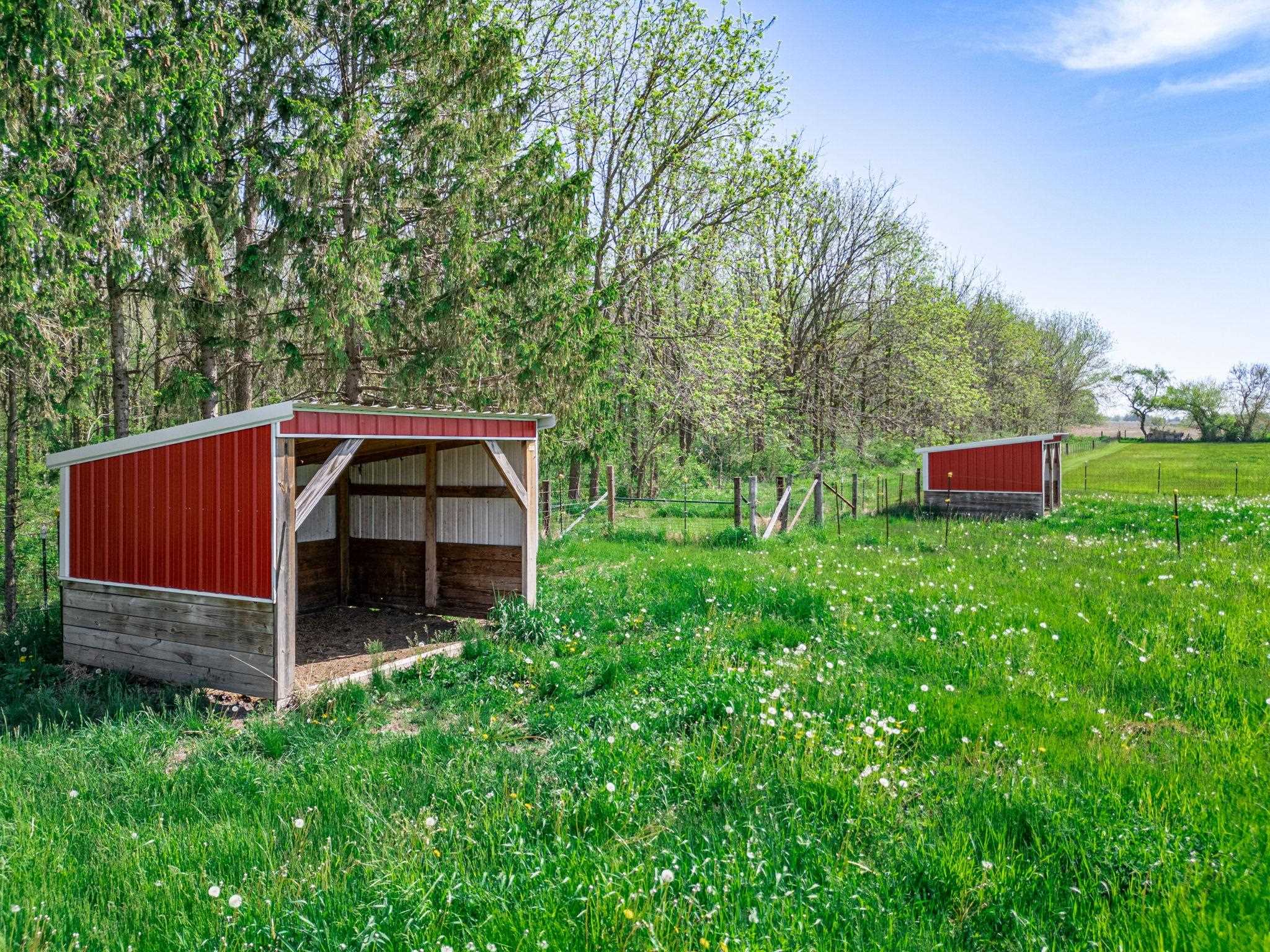 8235 Belvidere Road Caledonia, IL 61011 - Photo 35 of 40 a view of a barn with a yard