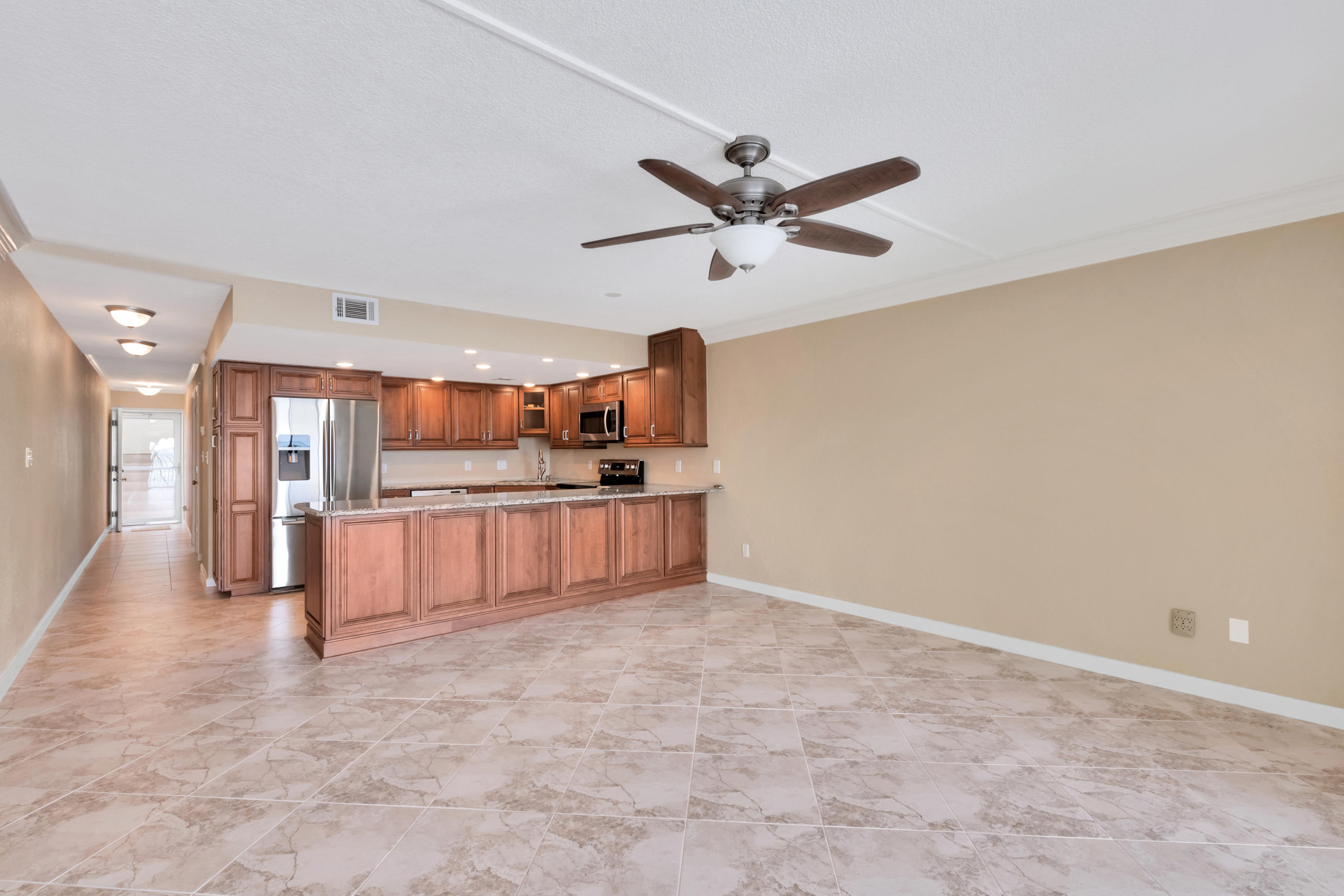151 Calhoun Avenue, Unit 409 Destin, FL 32541 - Photo 7 of 15 a view of kitchen with refrigerator and window