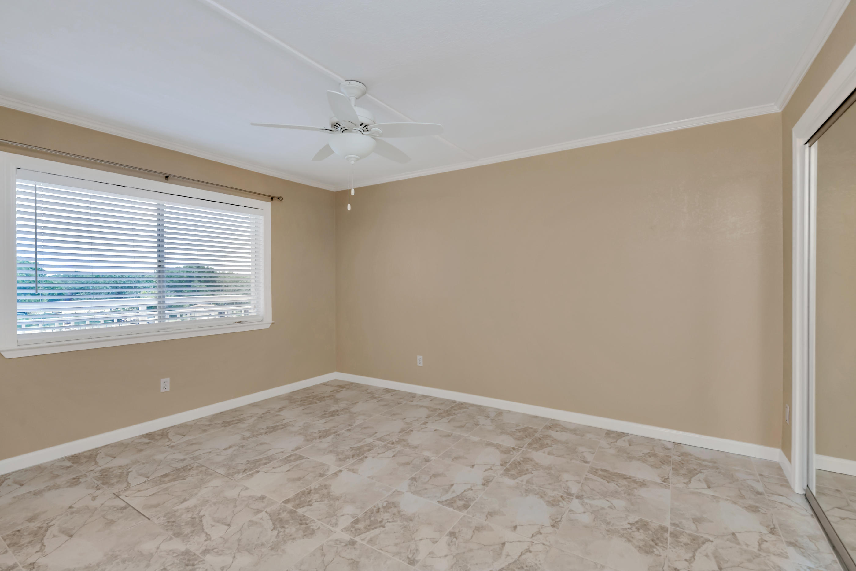 151 Calhoun Avenue, Unit 409 Destin, FL 32541 - Photo 10 of 15 a view of an empty room with a window