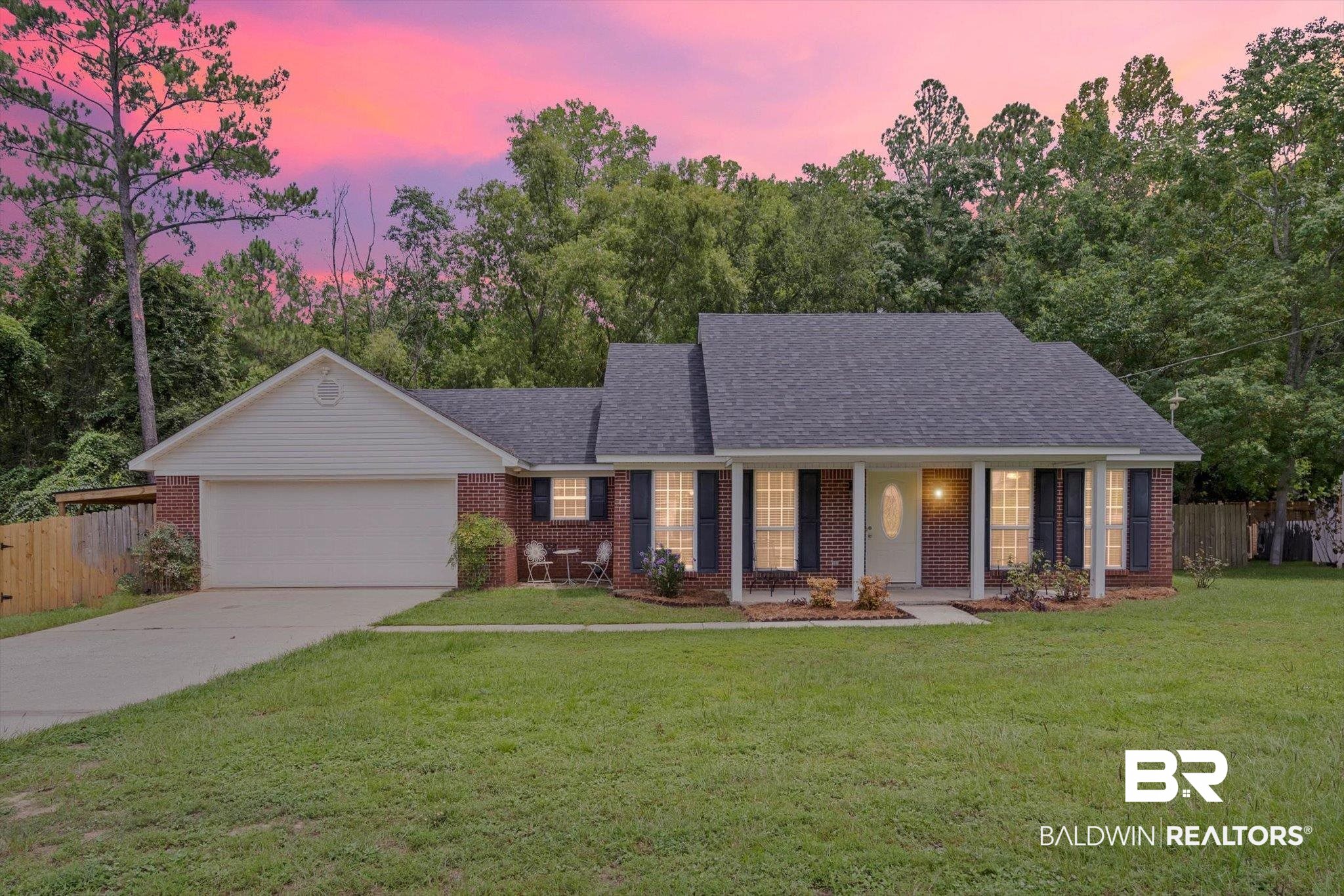 157 Bay View Drive Daphne, AL 36526 - Photo 1 of 22 Single story home featuring covered porch, concrete driveway, an attached garage, and brick siding