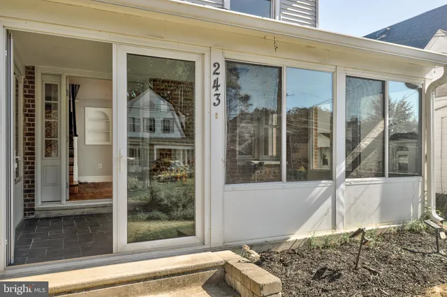 a view of a door of a house with a window