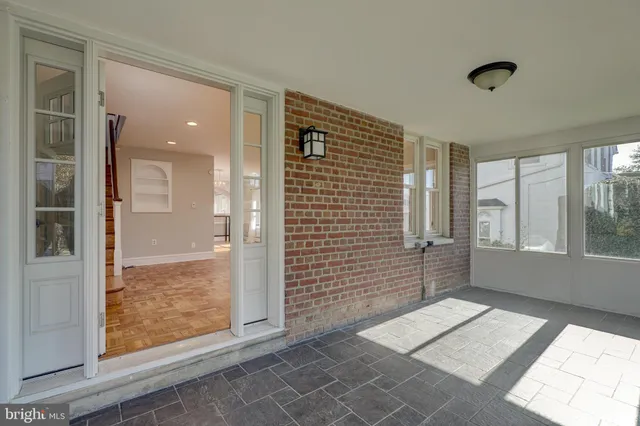 a view of a hallway with windows