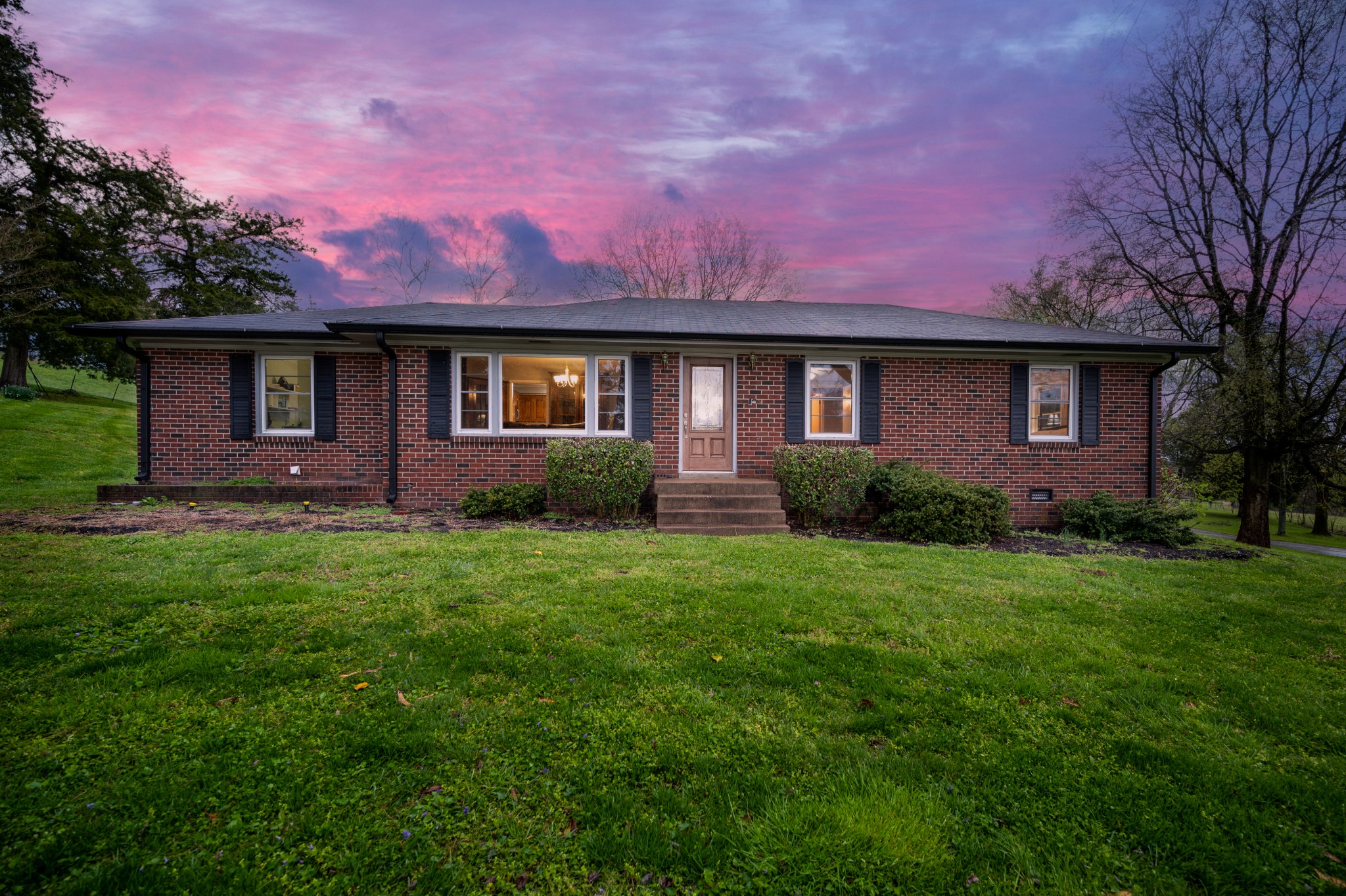 a view of a house with a garden