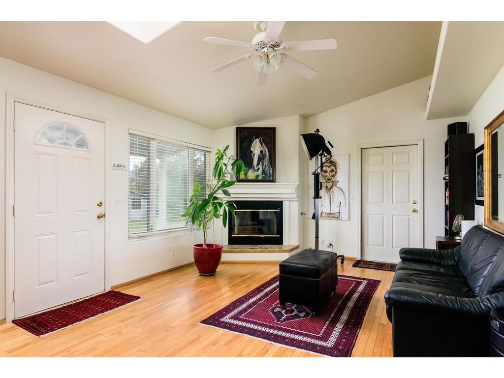 14803 Fruitvale Road Valley Center, CA 92082 - Photo 18 of 25 Gorgeous hardwood flooring. Vaulted ceilings, Decorative upper soffit with indirect lighting and Gas Fireplace.