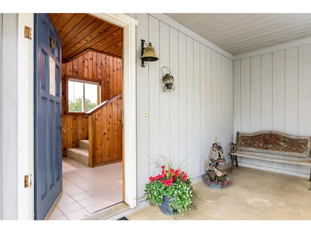 14803 Fruitvale Road Valley Center, CA 92082 - Photo 3 of 25 Front door to two story home, covered entry patio.