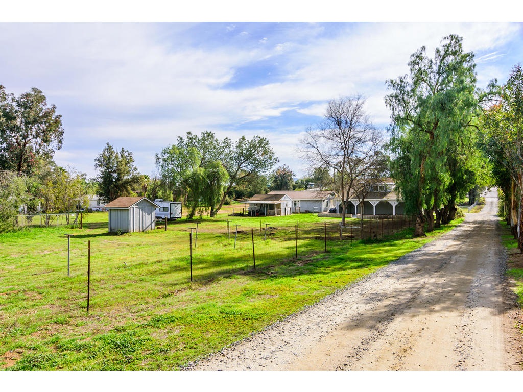 14803 Fruitvale Road Valley Center, CA 92082 - Photo 22 of 25 Tree lined private easement road leads to property entry.