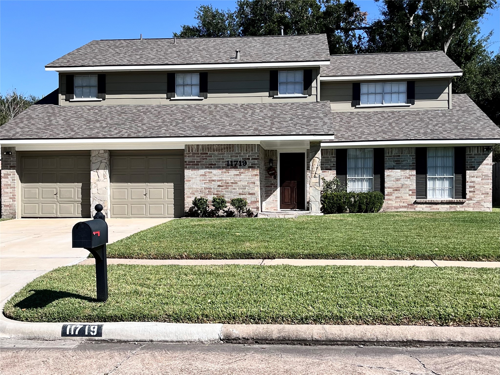 11719 Cedar Form Lane Meadows Place, TX 77477 - Photo 1 of 39 a front view of a house with a yard
