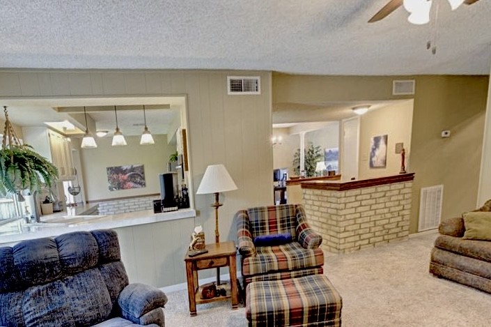11719 Cedar Form Lane Meadows Place, TX 77477 - Photo 11 of 39 a living room with furniture and a large window