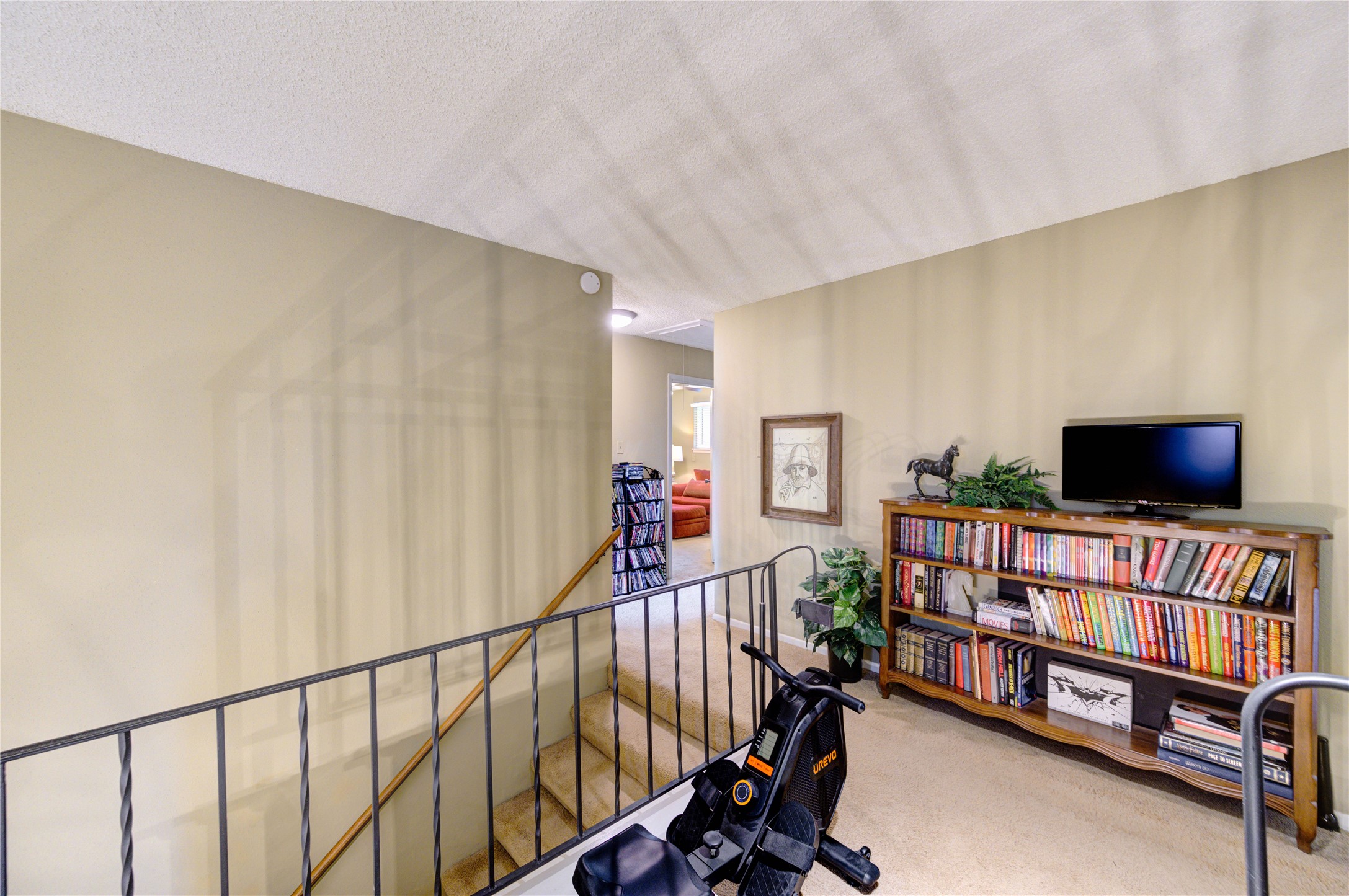 11719 Cedar Form Lane Meadows Place, TX 77477 - Photo 20 of 39 a living room with furniture and a flat screen tv
