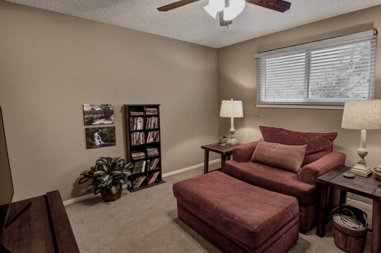 11719 Cedar Form Lane Meadows Place, TX 77477 - Photo 28 of 39 a bedroom with furniture and a chandelier