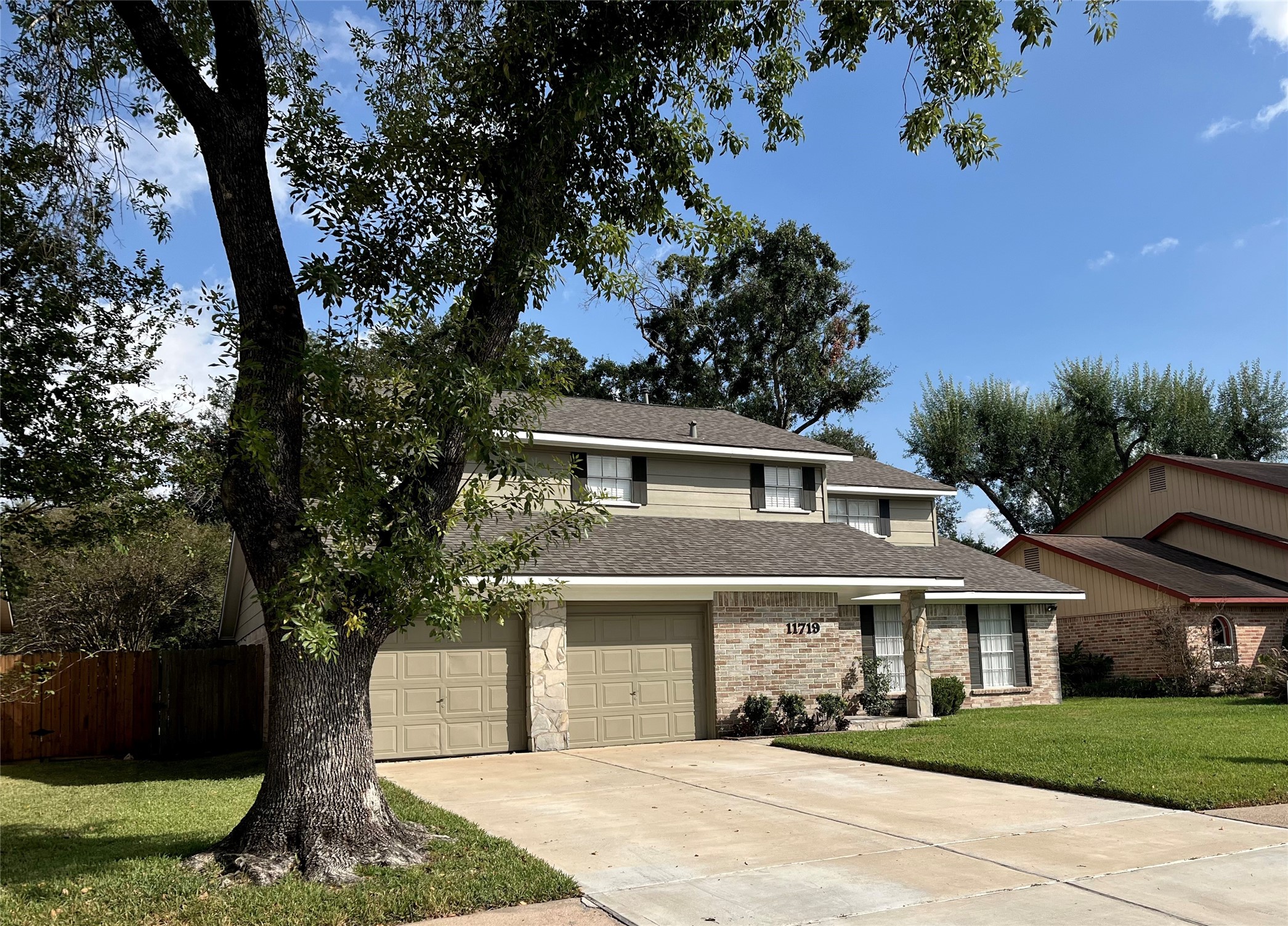 11719 Cedar Form Lane Meadows Place, TX 77477 - Photo 3 of 39 a front view of a house with a garden