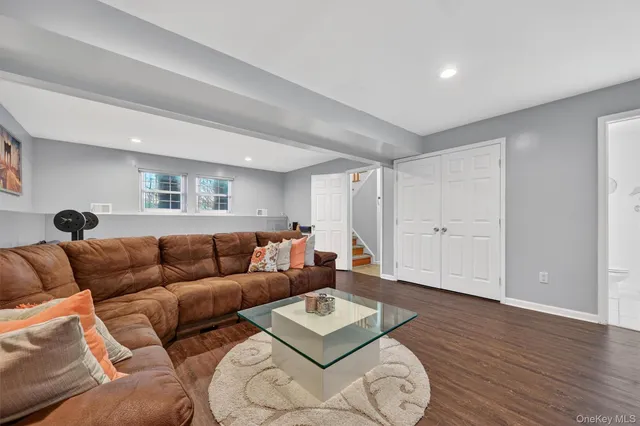 a bathroom with a sink mirror and toilet