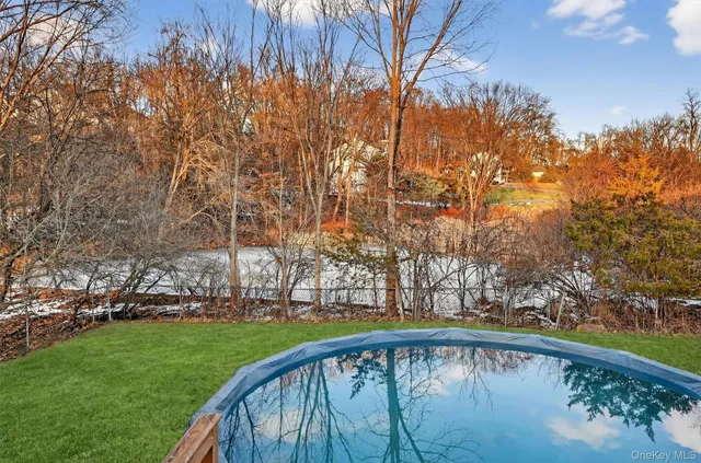 a view of house with outdoor space and deck