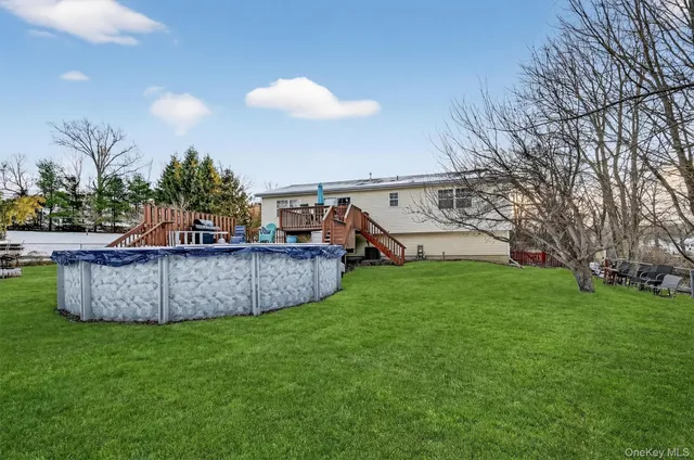 a view of a chairs and table in the garden