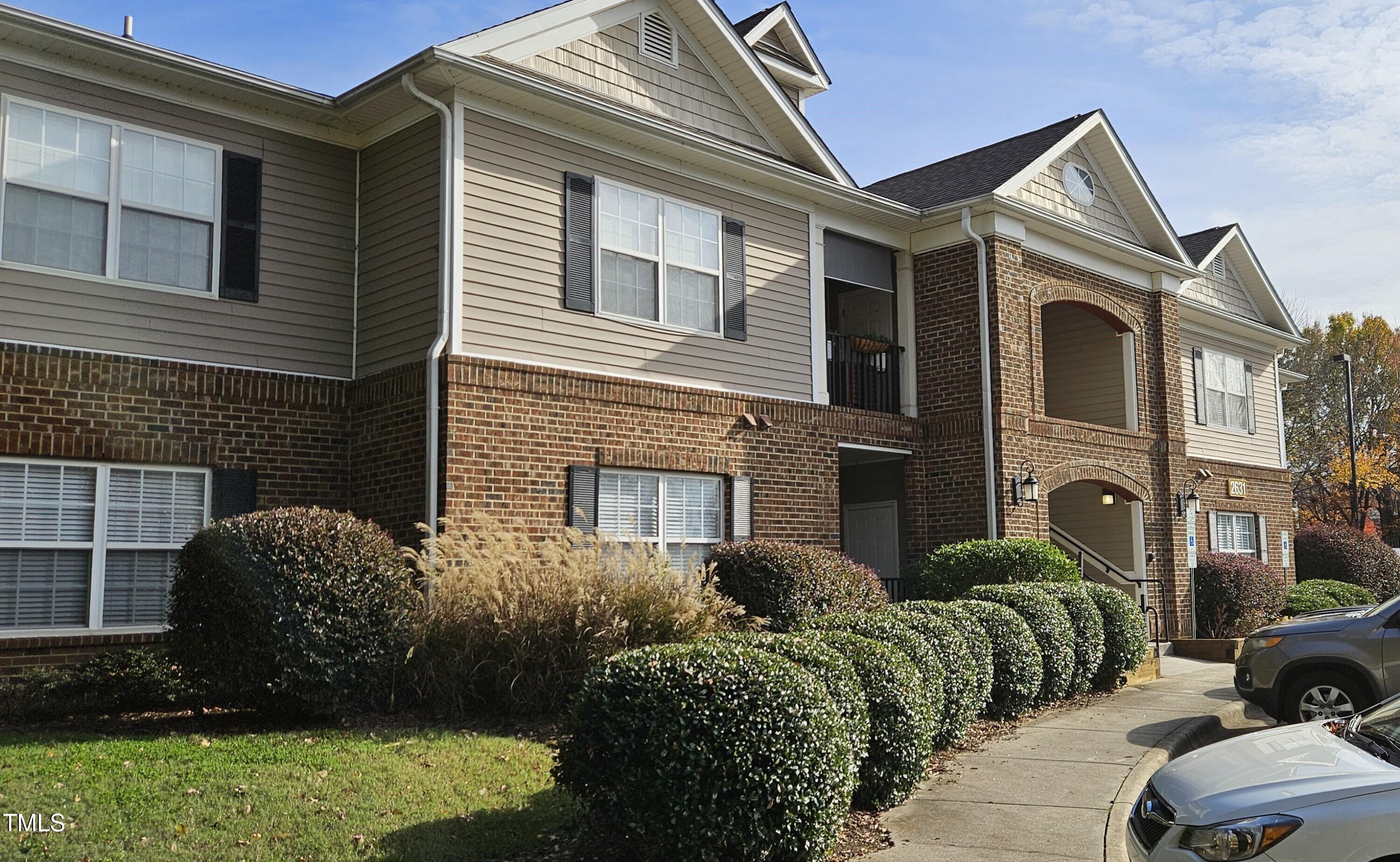 2631 Oldgate Drive, Unit 101 Raleigh, NC 27604 - Photo 1 of 11 a front view of a house with a garden