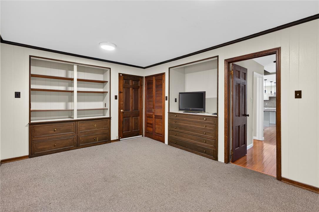 1371 Stoke Park Road Bethlehem, PA 18017 - Photo 26 of 55 Built-in shelving and warm wood details provide functional storage and character in this adaptable interior space.