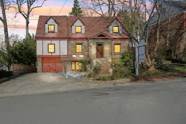 a front view of a house with yard
