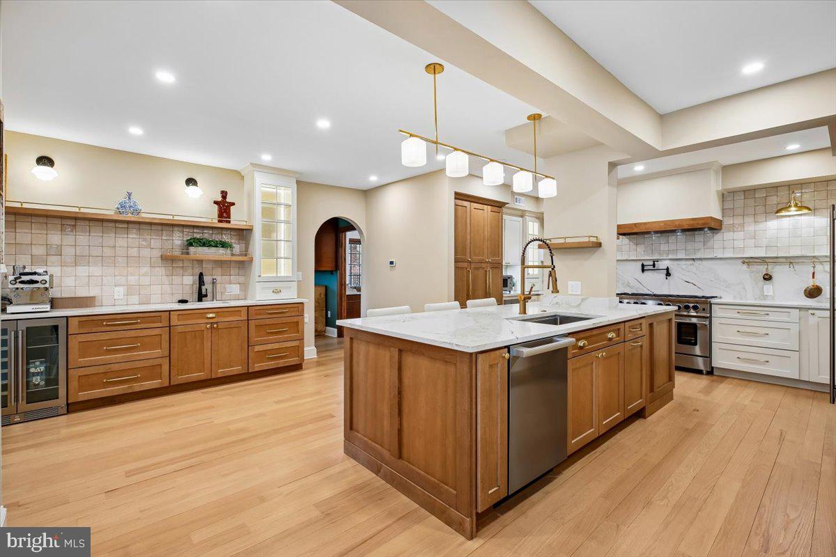 6317 Poe Road Bethesda, MD 20817 - Photo 12 of 43 a kitchen with stainless steel appliances granite countertop a sink and cabinets