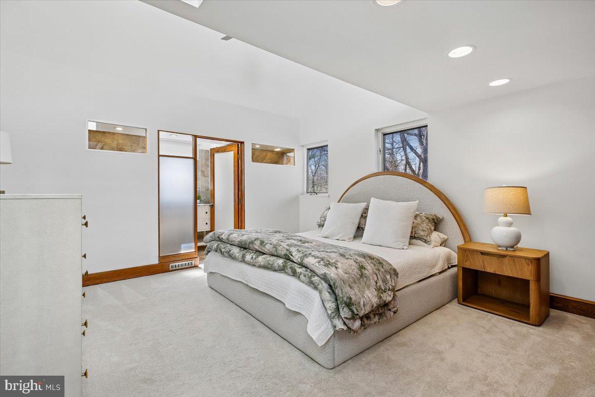 6317 Poe Road Bethesda, MD 20817 - Photo 20 of 43 a spacious bedroom with a bed and a window