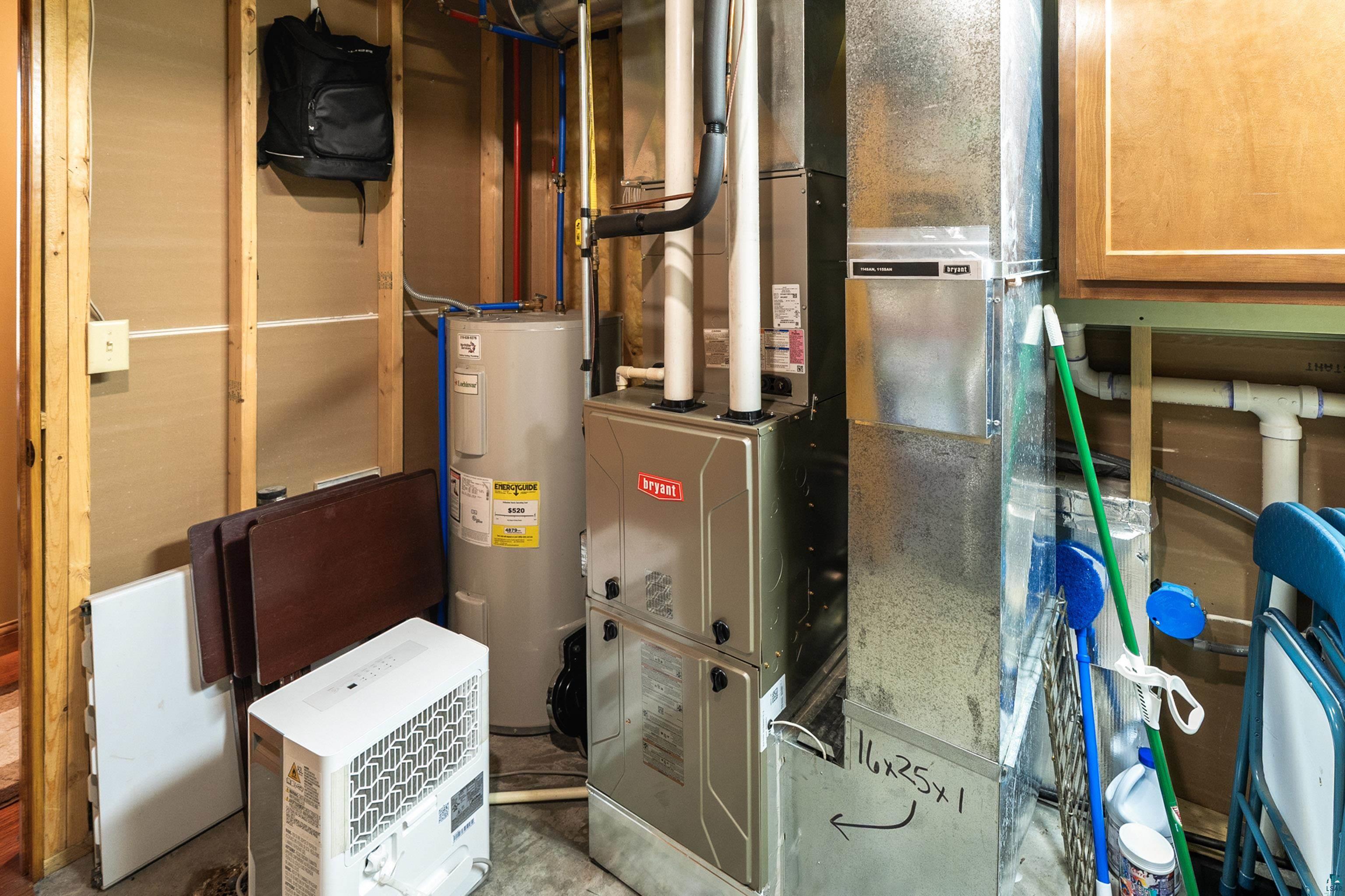 75 East Stark Road Esko, MN 55733 - Photo 49 of 87 Bryant furnace system with a water heater, exposed wood framing, and utility cabinetry