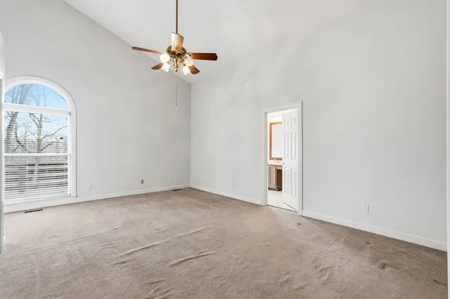 a view of a livingroom with a chandelier fan
