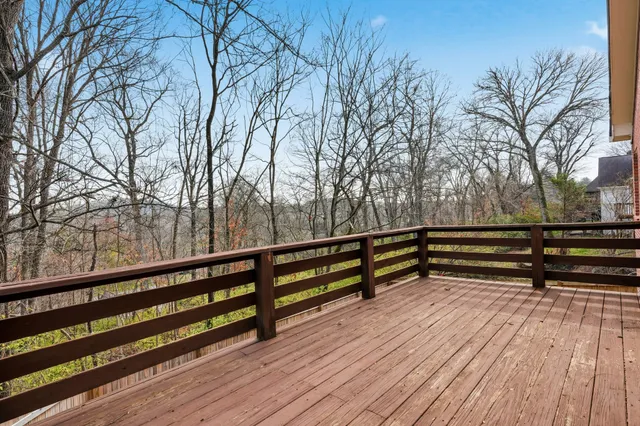 a view of a balcony with wooden floor