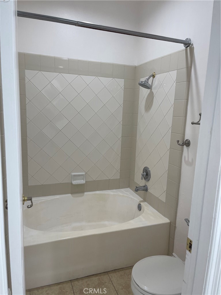 255 North Michigan Avenue Pasadena, CA 91106 - Photo 12 of 18 a white bath tub sitting next to a white toilet and sink