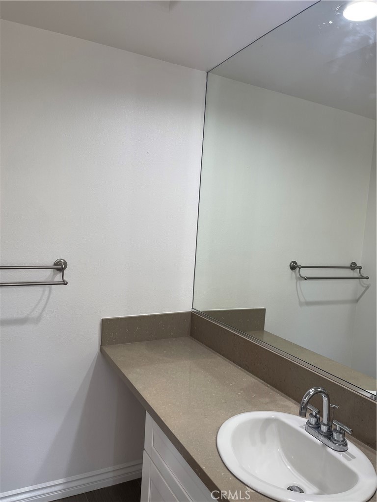 255 North Michigan Avenue Pasadena, CA 91106 - Photo 14 of 18 a bathroom with a sink and a mirror