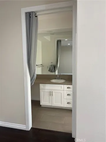a bathroom with a double vanity sink and mirror