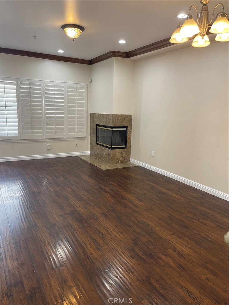 255 North Michigan Avenue Pasadena, CA 91106 - Photo 6 of 18 an empty room with wooden floor and windows