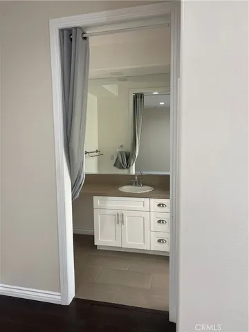 a bathroom with a double vanity sink and mirror