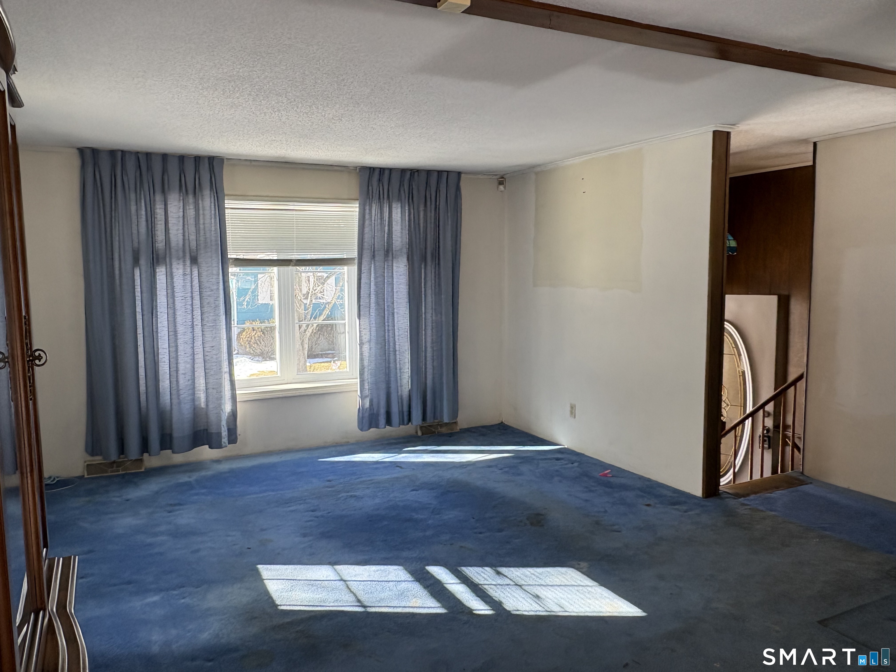 249 Malcolm Road West Haven, CT 06516 - Photo 15 of 17 an empty room with wooden floor and windows