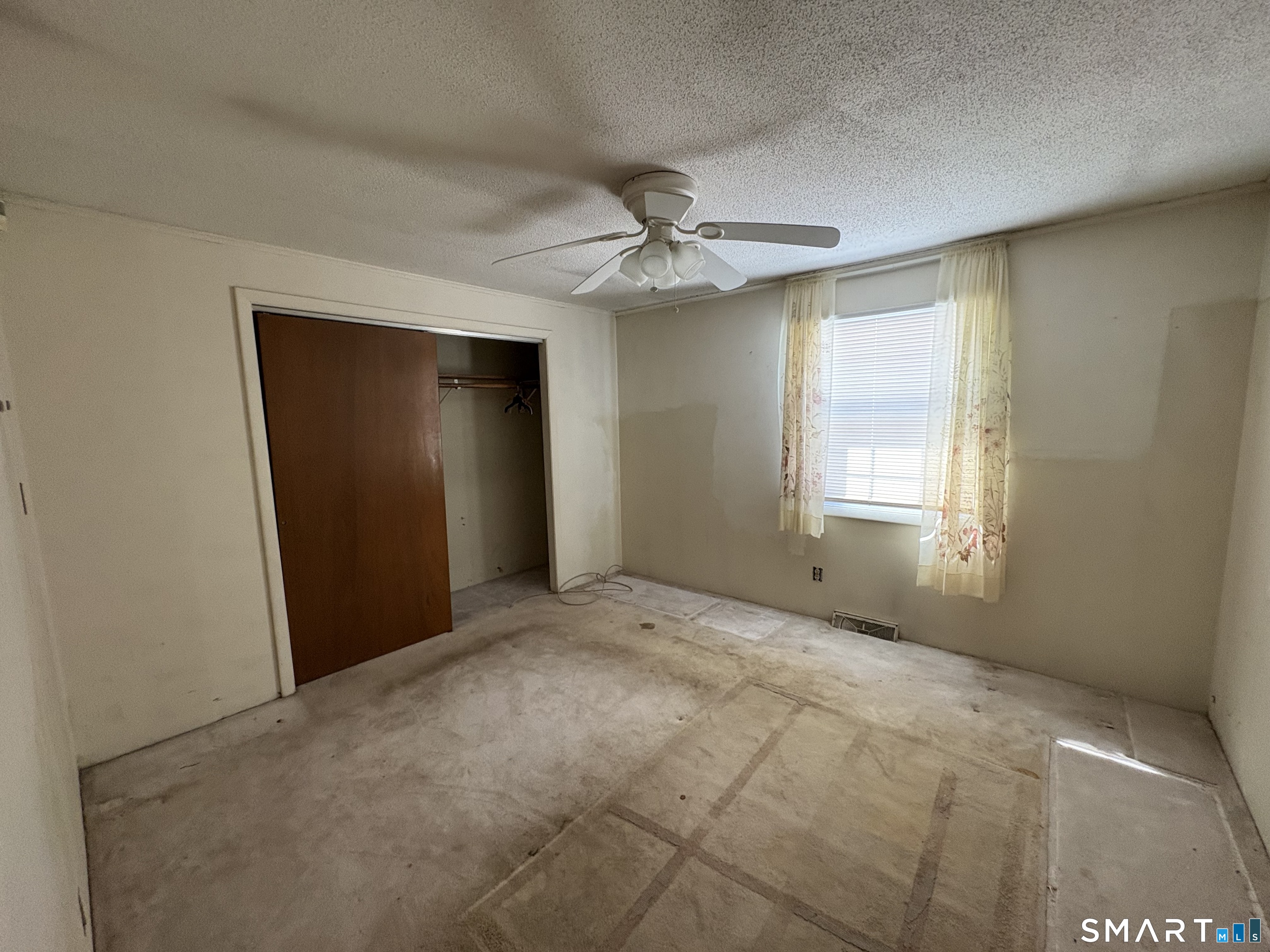 249 Malcolm Road West Haven, CT 06516 - Photo 5 of 17 a view of an empty room with a window