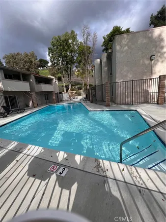 a view of a backyard with sitting area