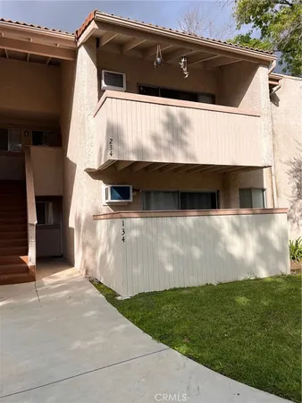 a view of house with backyard