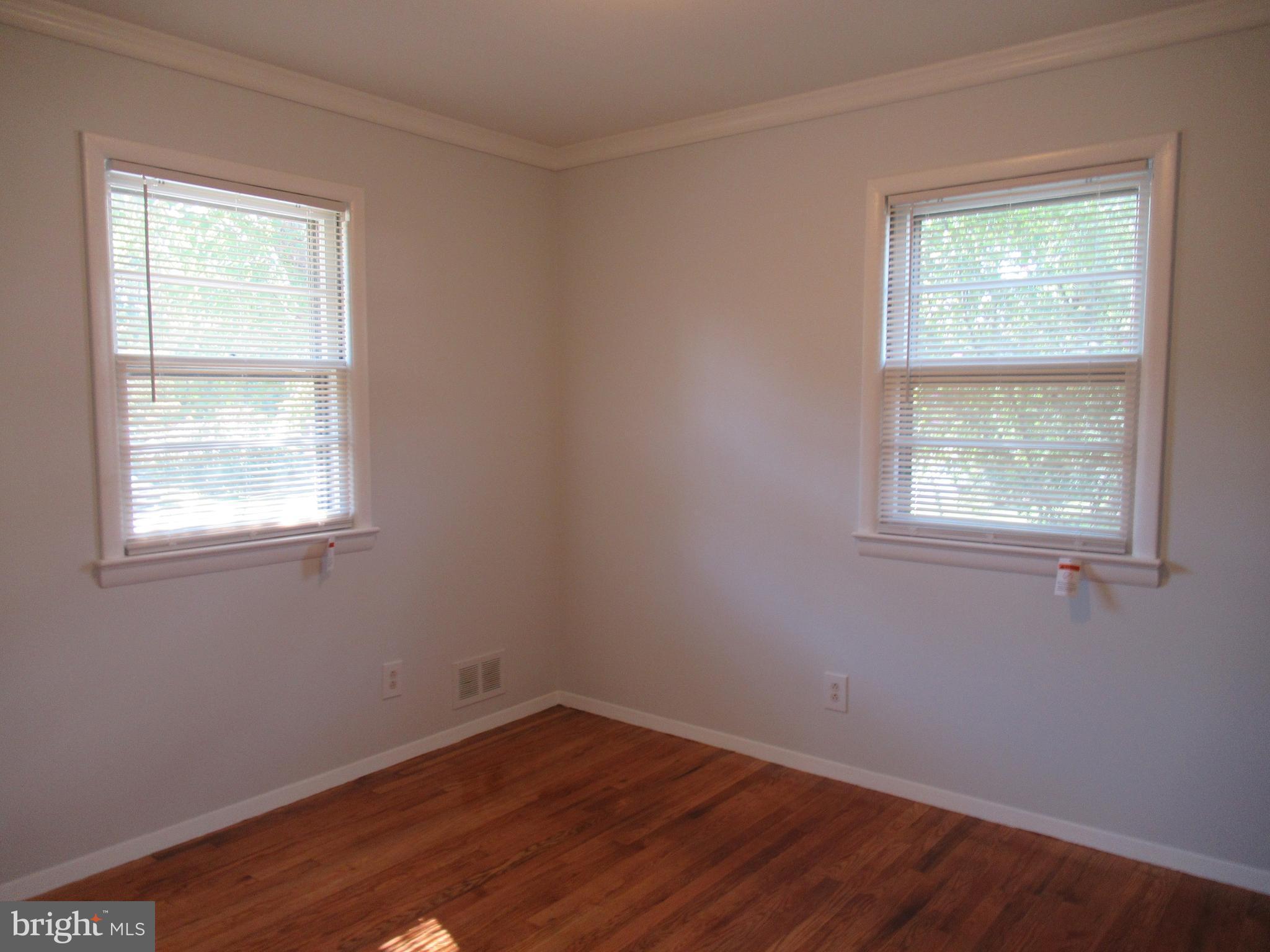 5608 Berwyn Road Berwyn Heights, MD 20740 - Photo 8 of 24 an empty room with a window