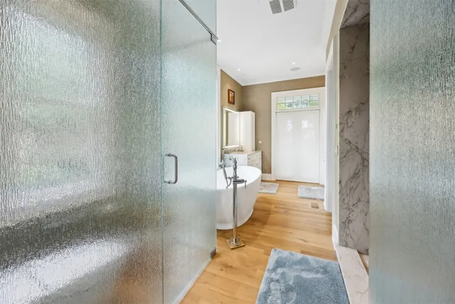 a bathroom with a bathtub and a shower